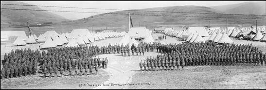 121st Western Irish Battalion and rock crest in front of tents at Camp Vernon