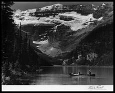 Ed Feuz and Mrs. Nick Morrant in a canoe on Lake Louise