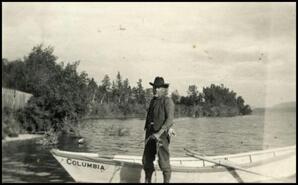 M.J. Lorraine beside his boat the 'Columbia'