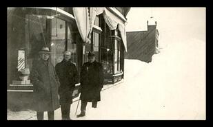 Sam Hunter, John Paterson, Mr. Giegerich in front of store, Kaslo