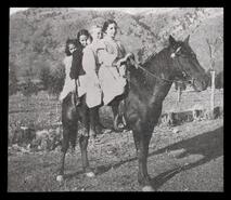 Four girls on a horse