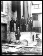 Group of men at Alexander smelter, Hospital Creek
