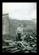 Madeleine Ekins chopping wood
