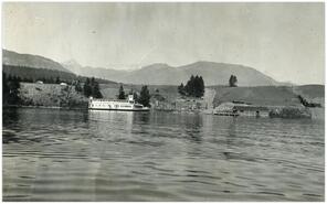 River boat and boat house on lake in Invermere