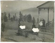 [Group photograph at house overlooking the lake]