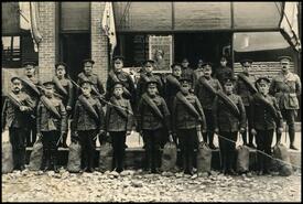 Soldiers with bandoliers and duffle bags