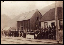 Funeral procession at a train station