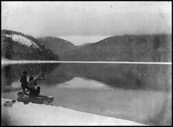 Hunters in boat on shores of Mabel Lake