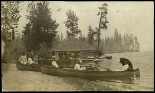 At Ole Johnson's - People in canoes at the waterfront