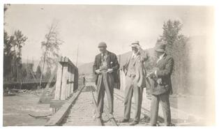 Three men on Nelson-Beddington Railway bridge