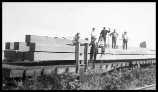 Loading lumber onto rail car at Vernon Box & Pine Lumber Co. Ltd.