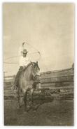 Unidentified cowboy on horseback with lasso