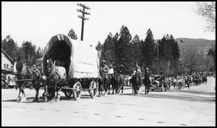 Covered wagon and outriders in the Silver Jubilee parade