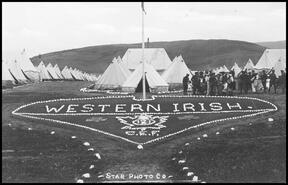 Postcard showing the 121st battalion, Western Irish rock crest at Camp Vernon