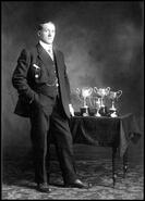 Chief R.N. Clerke with trophies for poultry