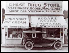 Automobile parked in front of Chase Drug Store