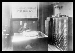 Frank Pearson, Bank of Hamilton manager in his office