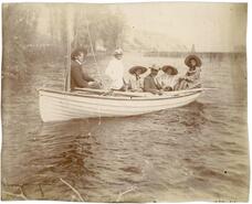 [Six people in a boat]