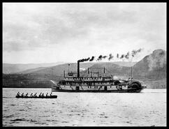 War canoe practicing near the S.S. Sicamous at Peachland