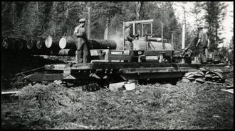 George and Frank Futa with Bill Durham at slabbing logs at portable sawmill at Futa Tie Mill