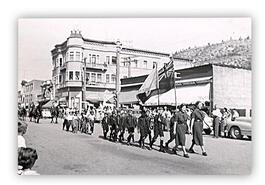 Labour Day parade, children marching behind women