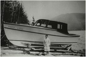 Unidentified woman standing in front of the "Mary Lou"