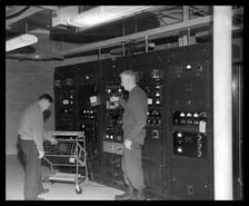 Department of Transportation installation with men checking equipment