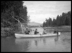 Lemuel Briggs, Earle Dickey, Garett Tomlinson and William Tomlinson canoeing on Columbia River