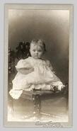 Unidentified baby, seated, looking at camera