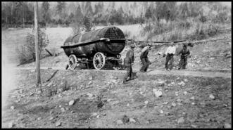 Sawmill construction crew moving a ten ton boiler to the sawmill site near Waneta where James Seeley came to from Washington