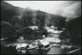 Norman Mackie's Tugboat "M.P.F." and Faye Mabee's two small houses on the Sicamous Narrows waterfront