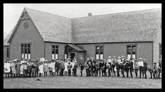 Students and teachers in front of Kaslo School
