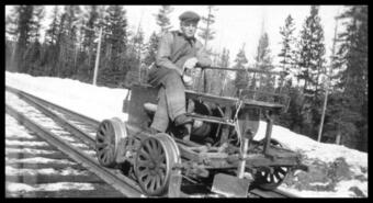 Man on a rail handcar