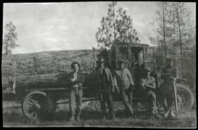 Men and logging truck