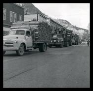 Logging trucks in National Forest Product Week parade 2nd St., Grand Forks