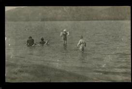 Group swimming in Christina Lake