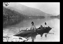 Indigenous group in a kootenay style canoe