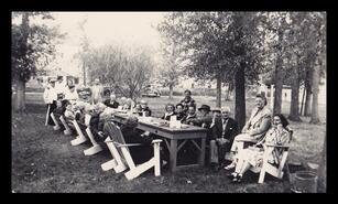 Group seated at a large picnic table