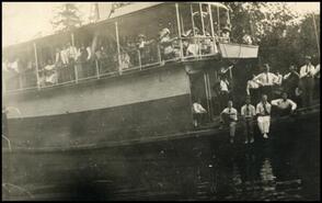 Passengers on two-story riverboat