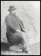 R.L. Cawston seated