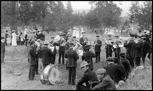 Fire Brigade band playing for the crowd at the Pleasant Valley Cemetery during a funeral