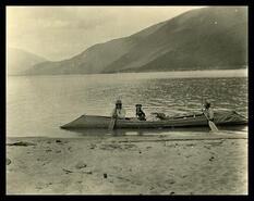 First Nations group on Kootenay Lake in sturgeon-nosed canoe