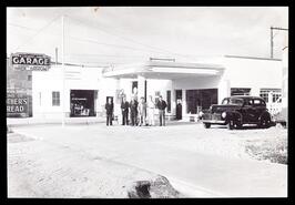 Group standing in front of W.J. Manery & Sons Garage