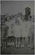 Group of children in front of C.P.R. coal chute