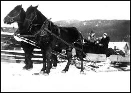 Wilfred and Isobel Simard with don David in horse drawn sleigh