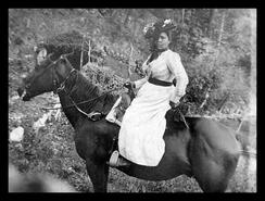 Indigenous woman on horseback