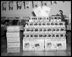 Employee Harry Geisler and the McCulloch's Aerated Waters Coca-Cola display at Safeway