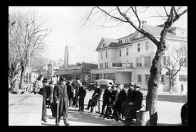 Group of men at Barnard/30th Avenue and the National Hotel