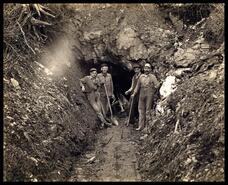 Group of miners at mine entrance