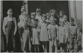 Children in front of the school on the hill